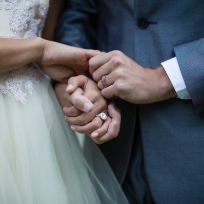 Wedding couple holding hands